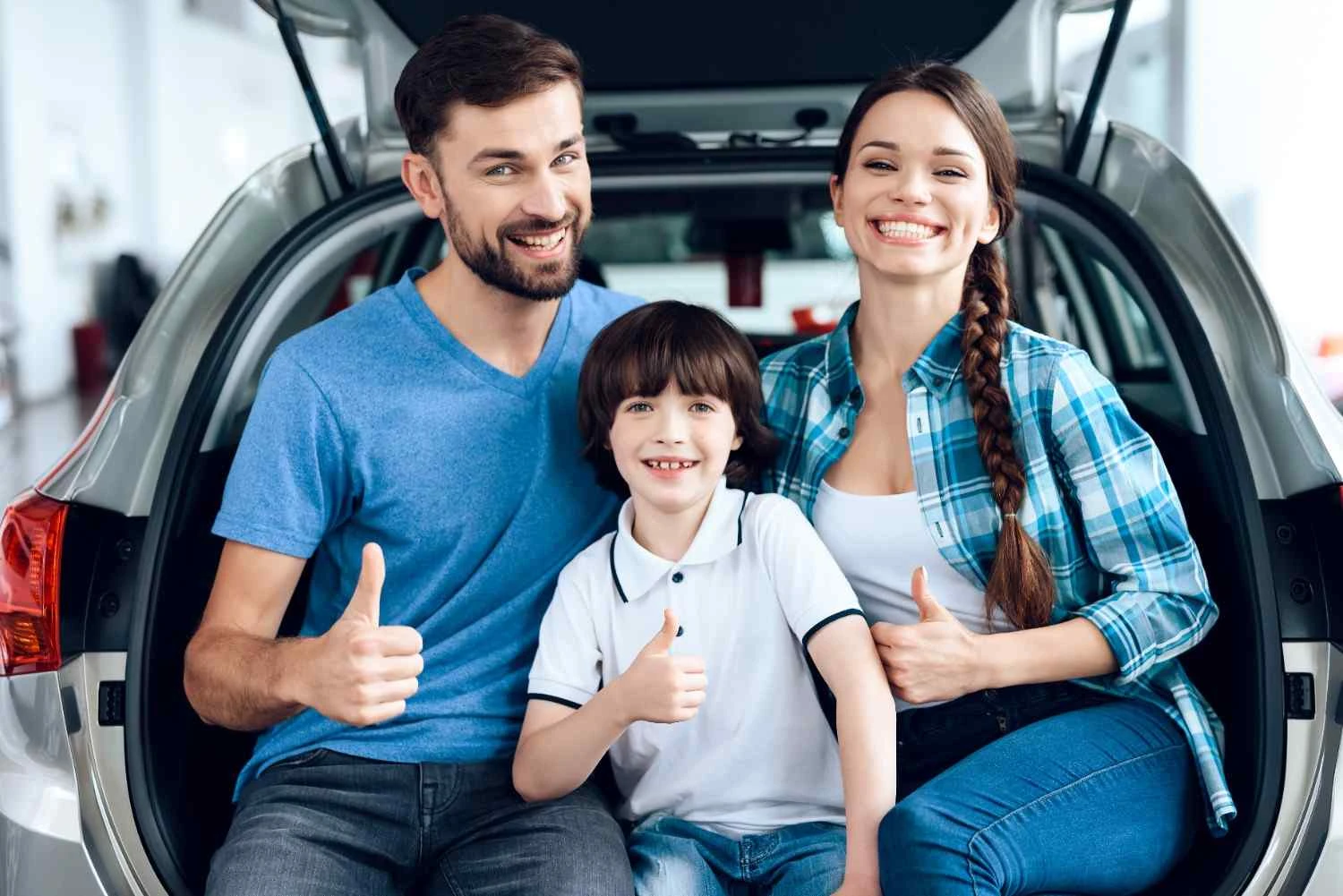 Happy family with their car